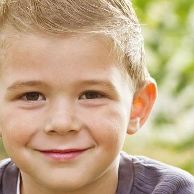 A young boy with protruding ears